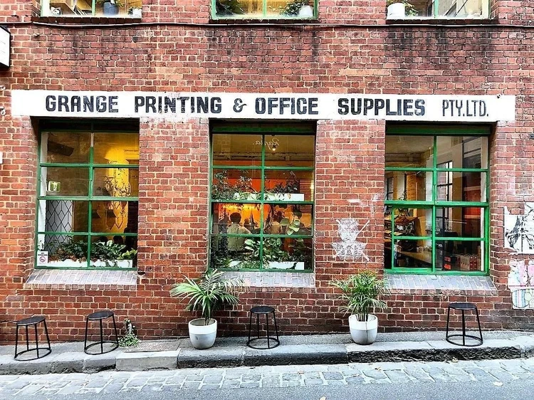 Brick Lane café’s leafy frontage and outdoor seating on Guildford Lane in Melbourne’s CBD